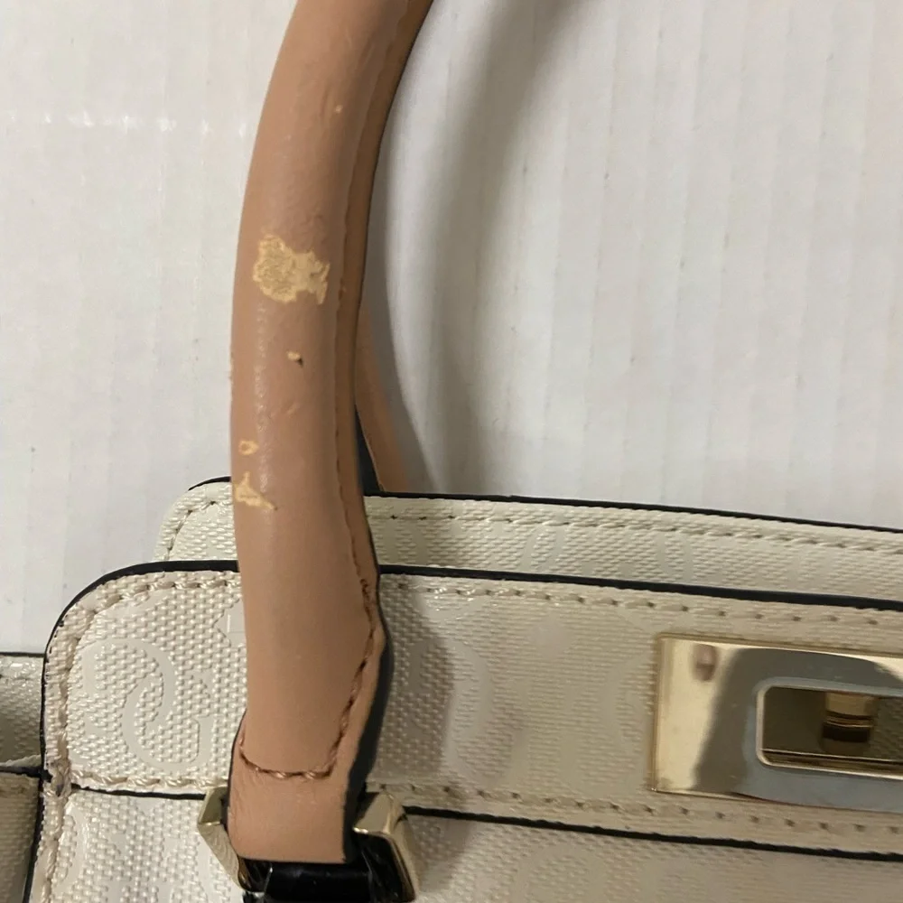 Guess purse cream w black flowers useful but well loved $49